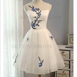 Beautiful white tulle dress with floral appliqué